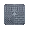 Tapis de léchage gris en silicone à ventouses pour chien et chat